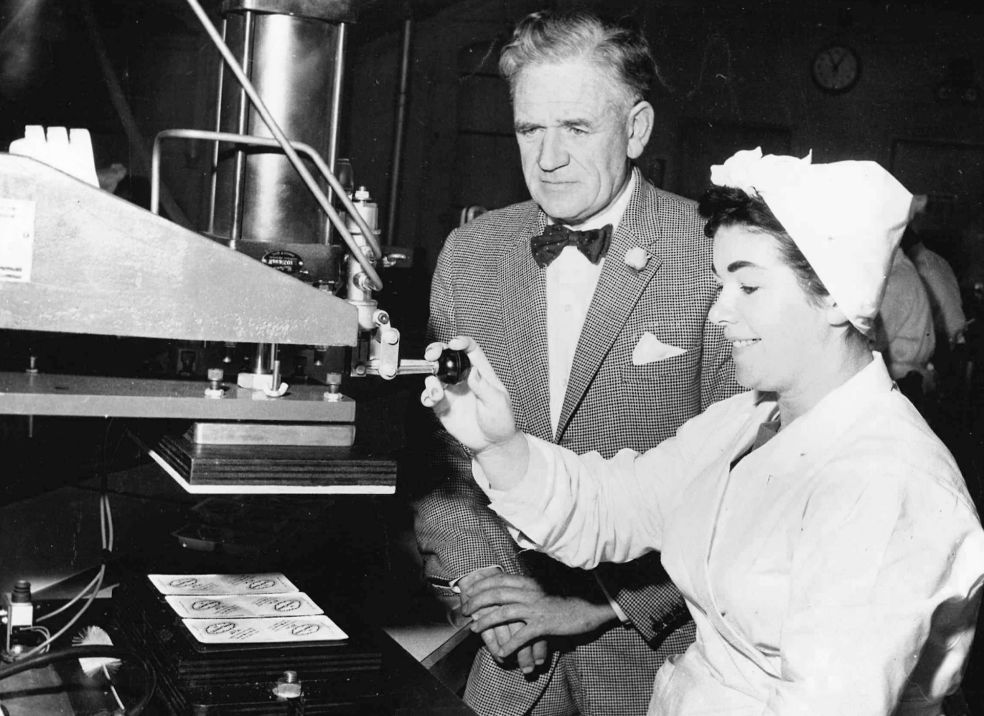 Ken Seaton with a woman making cheese