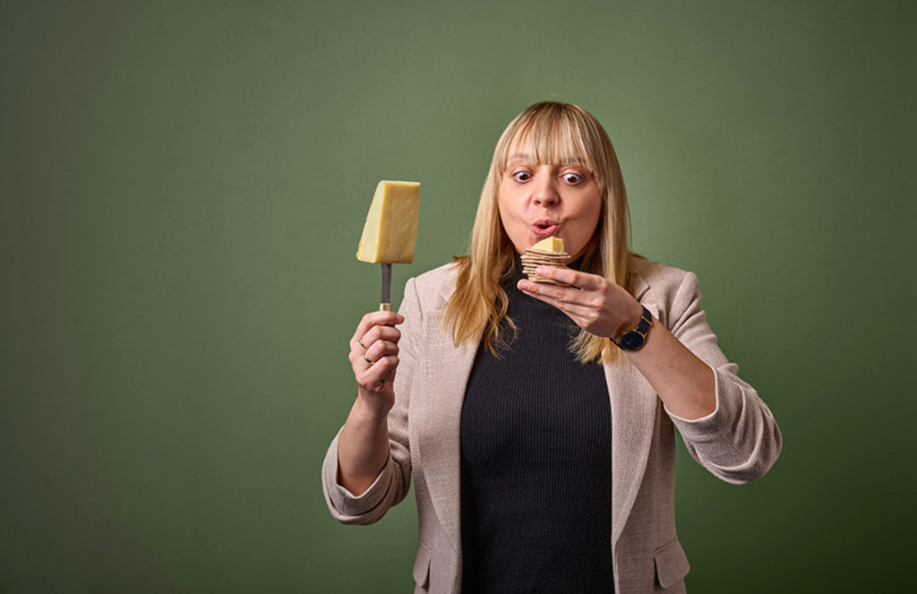 Woman with some cheese and crackers